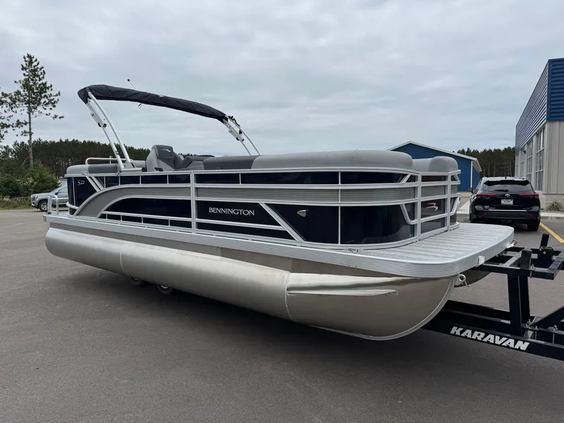 Slide: The Image of 2026 Bennington 22SSR pontoon boat parked on trailer. - 21
