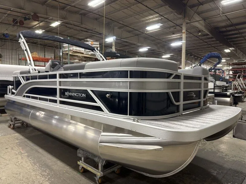 Slide: The Image of 2026 Bennington 22SSR pontoon boat in a warehouse. - 3