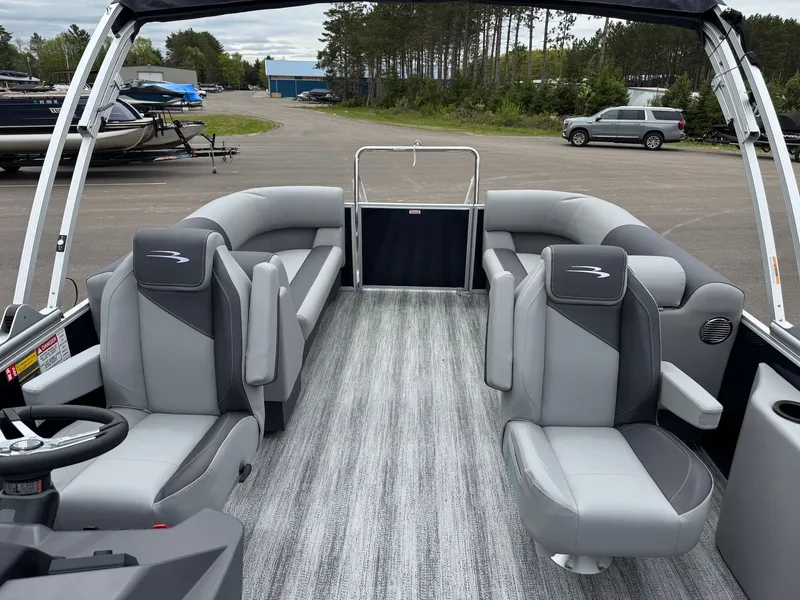 Slide: The Image of Interior of a 2026 Bennington 22SSR pontoon boat with gray seating. - 32