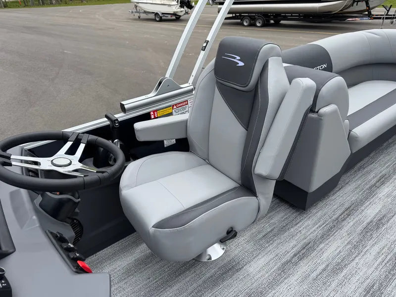 Slide: The Image of Interior of 2026 Bennington 22SSR with gray seats and steering wheel. - 34