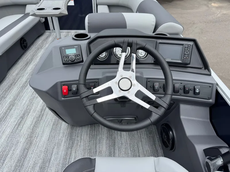 Slide: The Image of Interior view of 2026 Bennington 22SSR helm with steering wheel and instruments. - 35