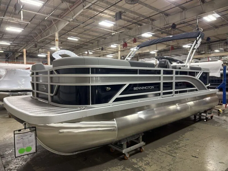Slide: The Image of 2026 Bennington 22SSR pontoon boat in a factory setting. - 4