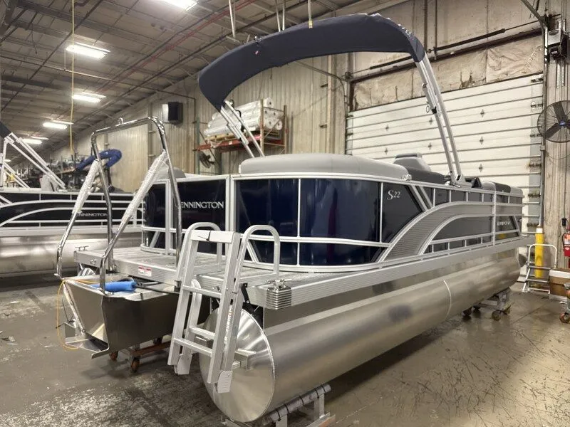Slide: The Image of 2026 Bennington 22SSR pontoon boat in warehouse. - 5