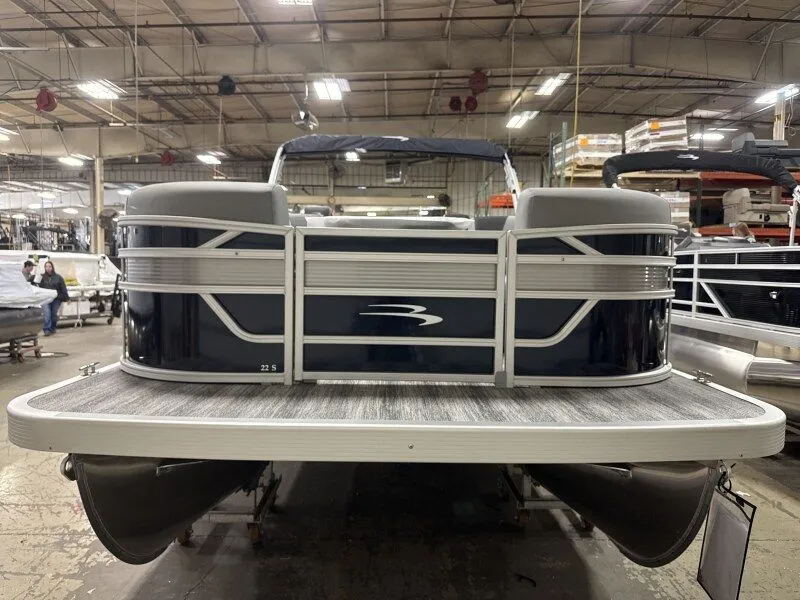 Slide: The Image of 2026 Bennington 22SSR pontoon boat in a factory setting. - 9
