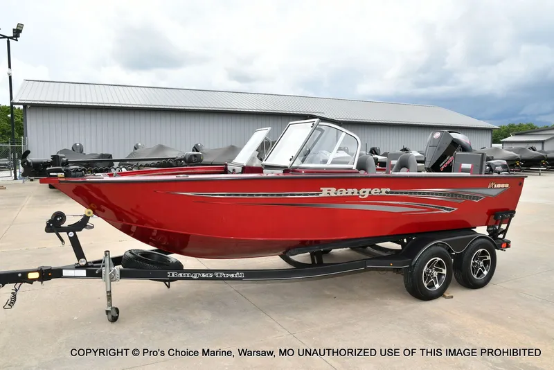 Slide: The Image of Red 2021 Ranger VX1888 WT boat parked on trailer. - 24