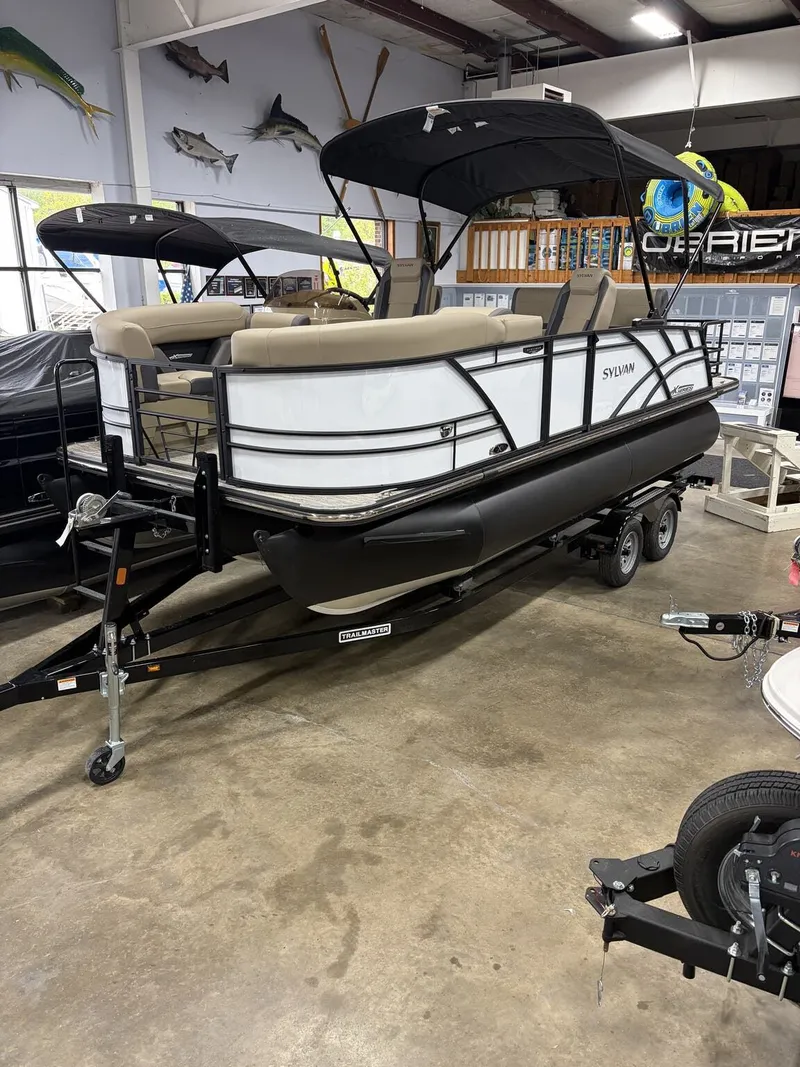 The Image of 2026 Sylvan Mirage X pontoon boat in showroom. - 1