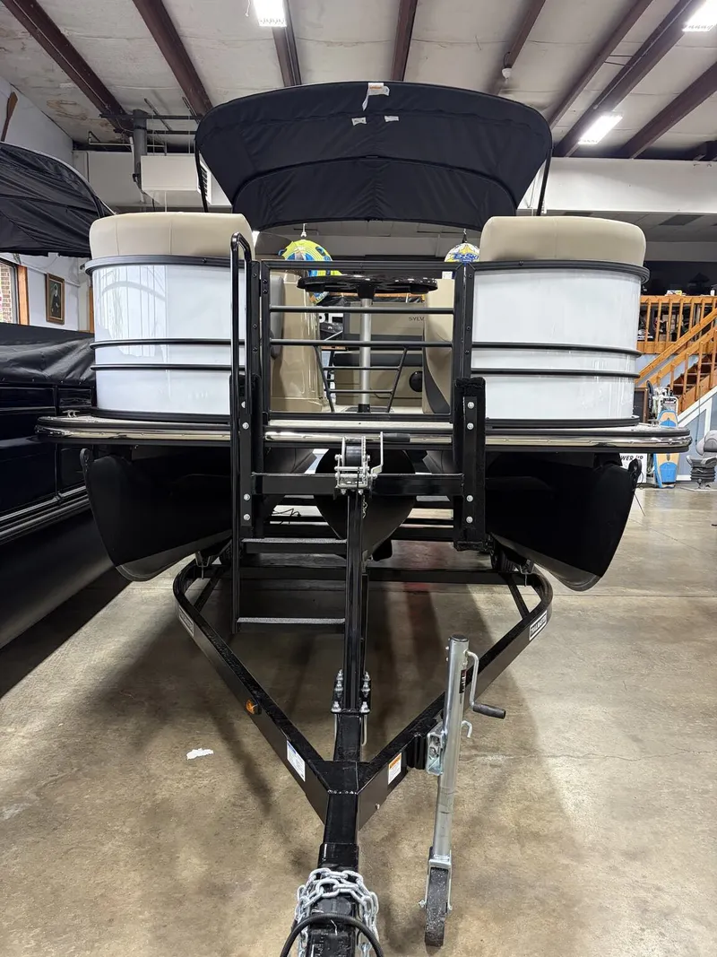 Slide: The Image of 2026 Sylvan Mirage X pontoon boat in warehouse. - 2