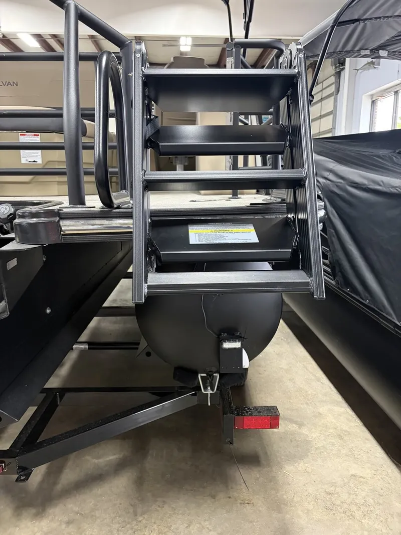 Slide: The Image of Sylvan Mirage X 2026 boat with interior ladder view. - 4