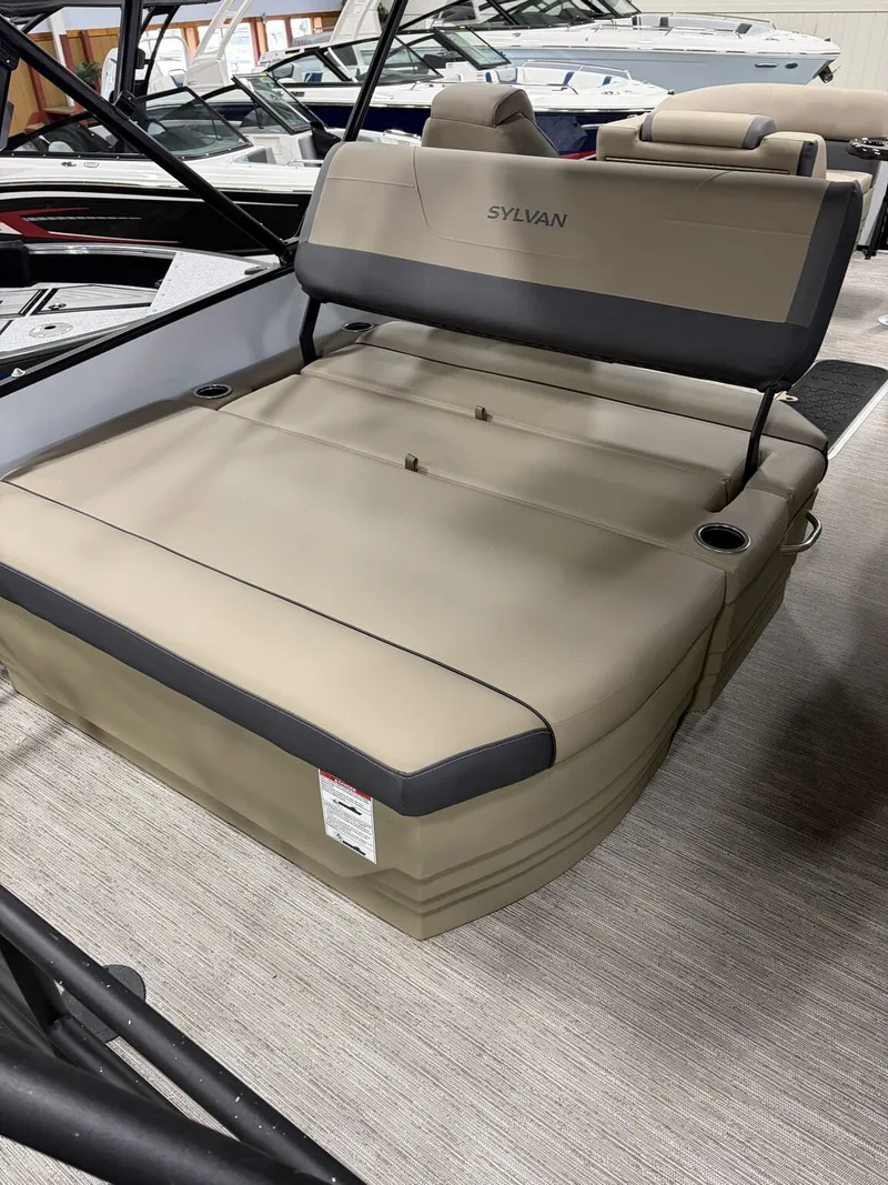 Slide: The Image of 2026 Sylvan Mirage X pontoon boat with beige seating area. - 5