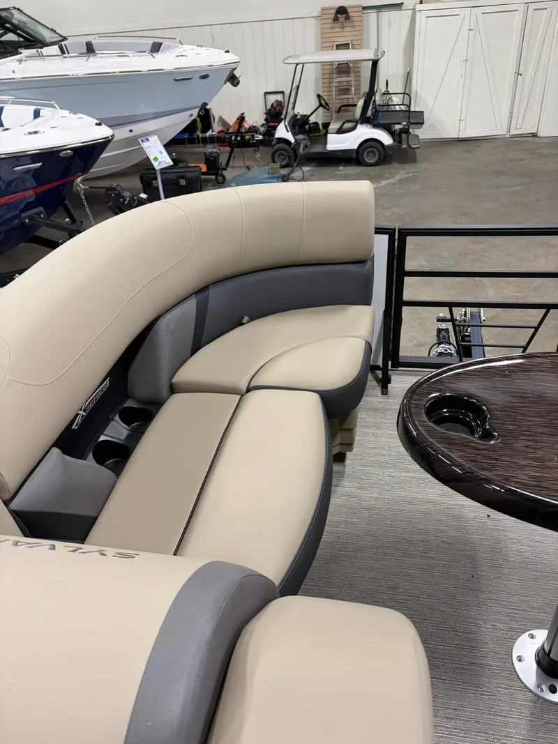 Slide: The Image of Interior of Sylvan Mirage X 2026 with beige seating area. - 9