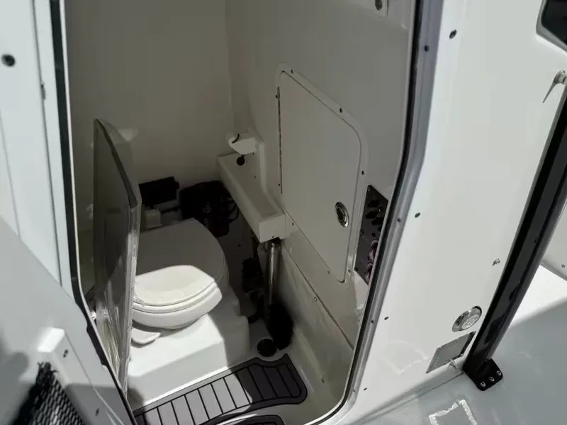 Slide: The Image of Interior of 2023 Sea Hunt Ultra 275 SE with toilet. - 14