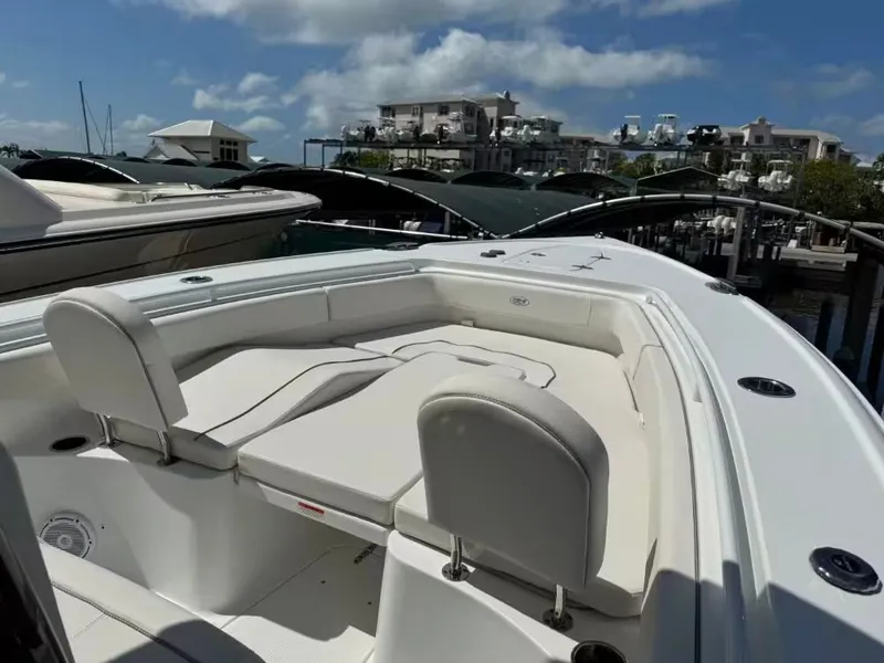Slide: The Image of 2023 Sea Hunt Ultra 275 SE boat with luxurious seating area. - 17
