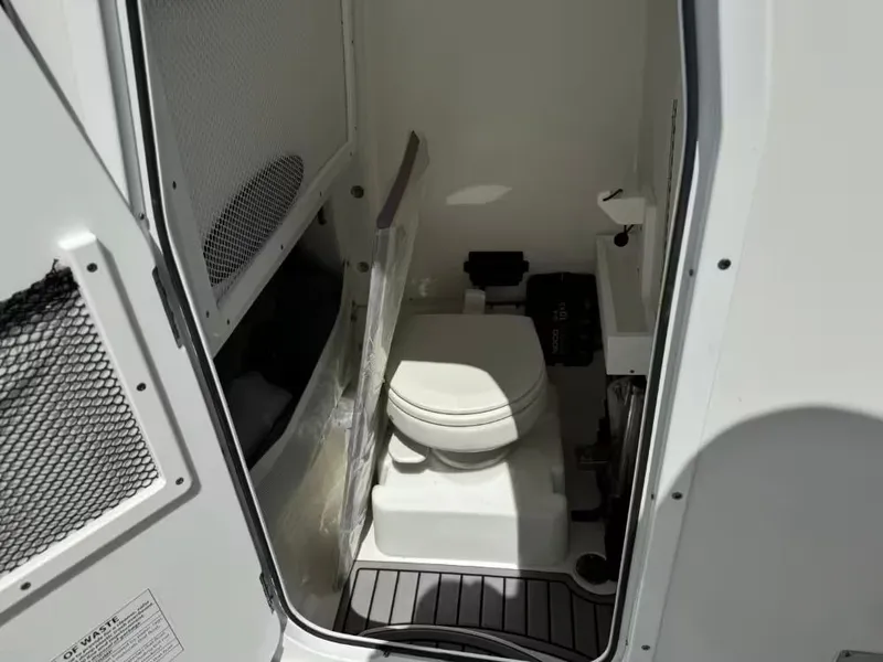 Slide: The Image of Interior of 2023 Sea Hunt Ultra 275 SE featuring a toilet. - 21