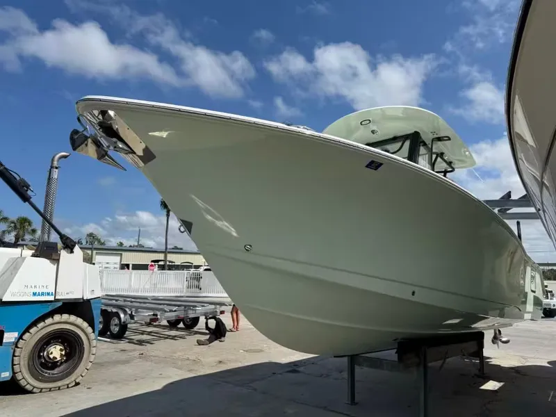 Slide: The Image of 2023 Sea Hunt Ultra 275 SE boat at the marina. - 3