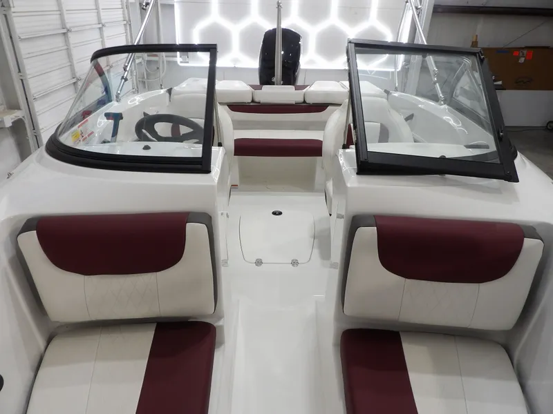Slide: The Image of Interior of a 2022 Tahoe 185 boat with red and white seating. - 12