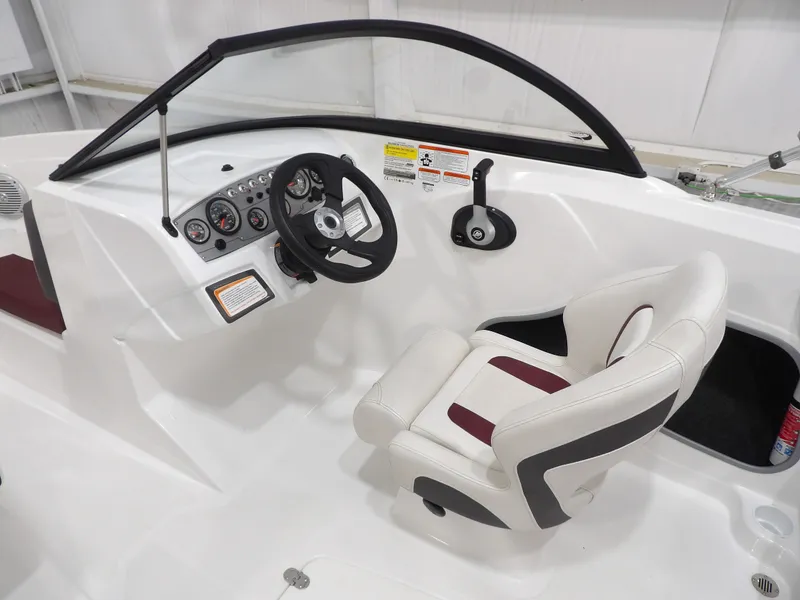 Slide: The Image of Interior of a 2022 Tahoe 185 boat with steering console. - 15