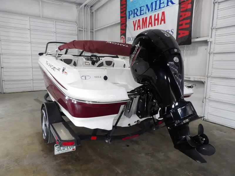Slide: The Image of 2022 Tahoe 185 boat with outboard motor in warehouse. - 8