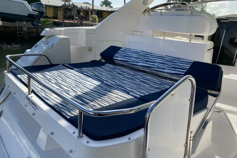 Slide: The Image of 2007 Regal 3760 Commodore yacht with striped sunbed on deck. - 14