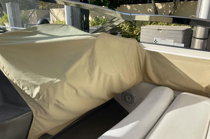 Slide: The Image of 2007 Regal 3760 Commodore boat interior with beige cover and seating. - 18