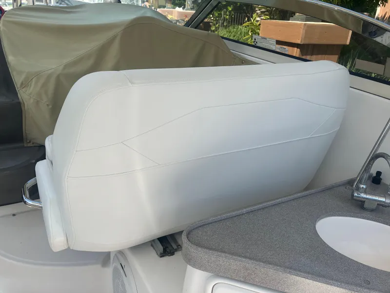 Slide: The Image of 2007 Regal 3760 Commodore boat interior with white seating and countertop. - 21