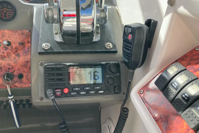 Slide: The Image of Control panel of a 2007 Regal 3760 Commodore boat with radio and throttle. - 24