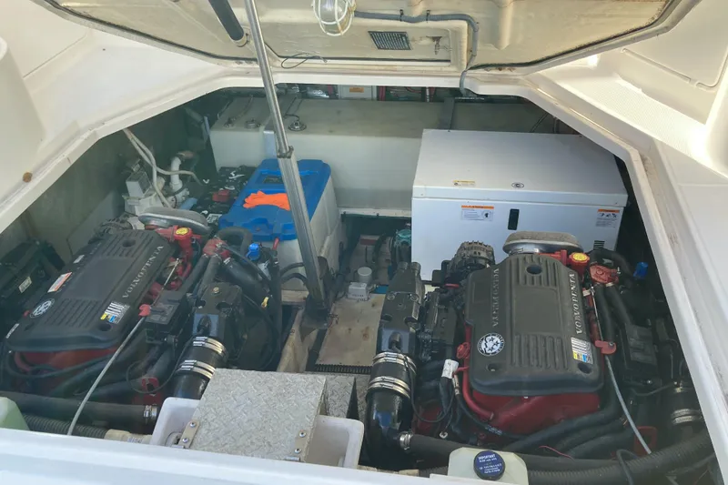 Slide: The Image of Engine compartment of a 2007 Regal 3760 Commodore boat, featuring dual engines. - 26