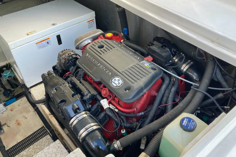 Slide: The Image of Engine compartment of a 2007 Regal 3760 Commodore boat, featuring a Volvo Penta engine. - 27
