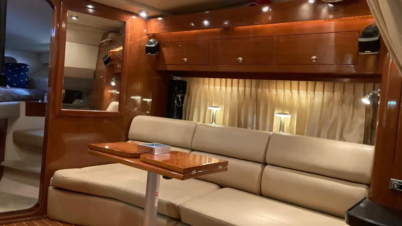Slide: The Image of Luxurious interior of a 2007 Regal 3760 Commodore yacht with elegant seating and wood finishes. - 33