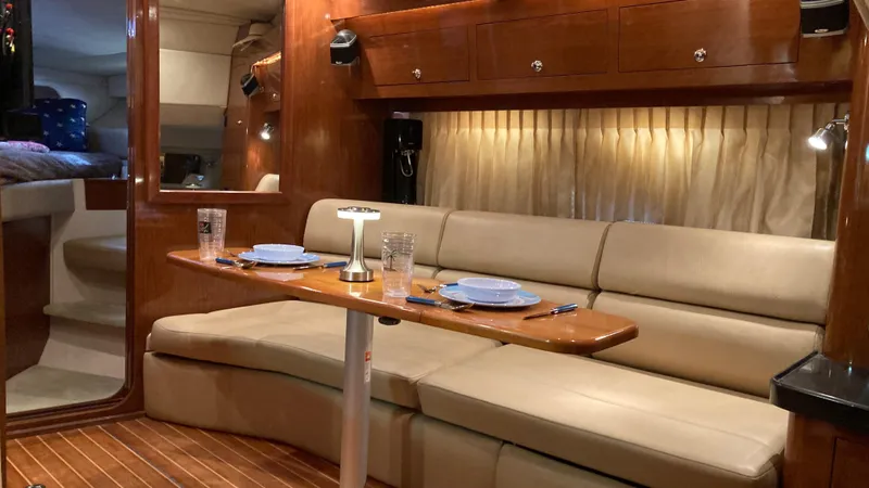 Slide: The Image of Luxurious interior of 2007 Regal 3760 Commodore yacht with elegant seating and dining area. - 34