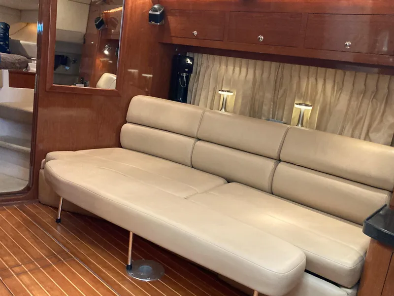 Slide: The Image of Luxurious interior of 2007 Regal 3760 Commodore yacht with beige leather seating. - 36