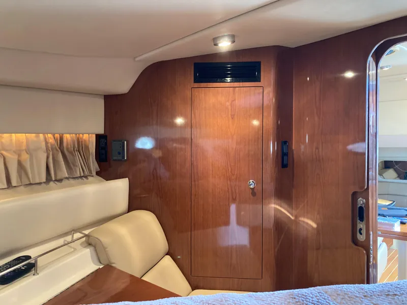 Slide: The Image of Interior of 2007 Regal 3760 Commodore yacht with wood paneling and seating. - 45