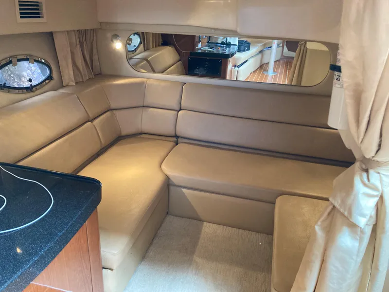 Slide: The Image of Luxurious interior of 2007 Regal 3760 Commodore yacht with beige leather seating. - 49