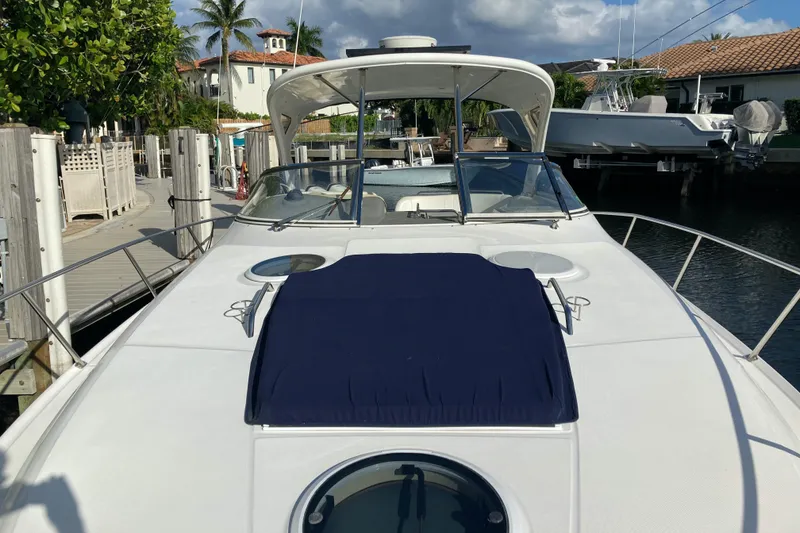 Slide: The Image of 2007 Regal 3760 Commodore yacht docked at a marina under a clear sky. - 5