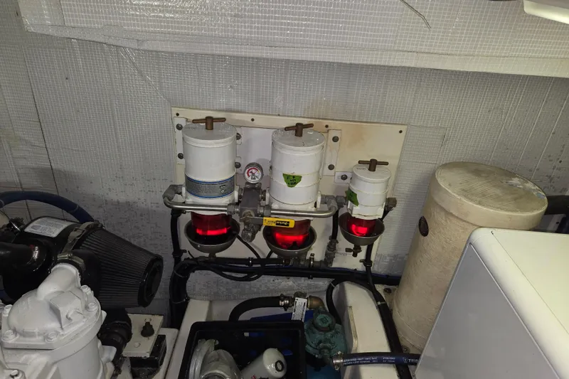 Slide: The Image of Engine room of 2012 American Tug 365 Flybridge with fuel filters and equipment. - 101