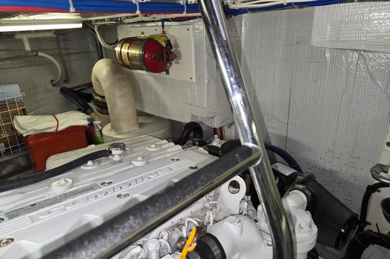 Slide: The Image of Engine room of 2012 American Tug 365 Flybridge with Cummins engine and safety equipment. - 103