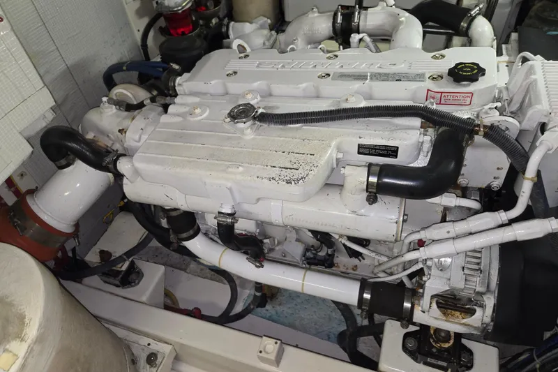 Slide: The Image of Engine compartment of a 2012 American Tug 365 Flybridge boat, showcasing mechanical components. - 107