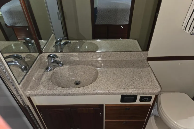 Slide: The Image of Bathroom vanity with sink and mirror in 2012 American Tug 365 Flybridge yacht. - 11