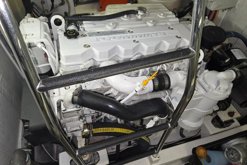 Slide: The Image of Engine compartment of a 2012 American Tug 365 Flybridge, featuring a Cummins engine. - 16