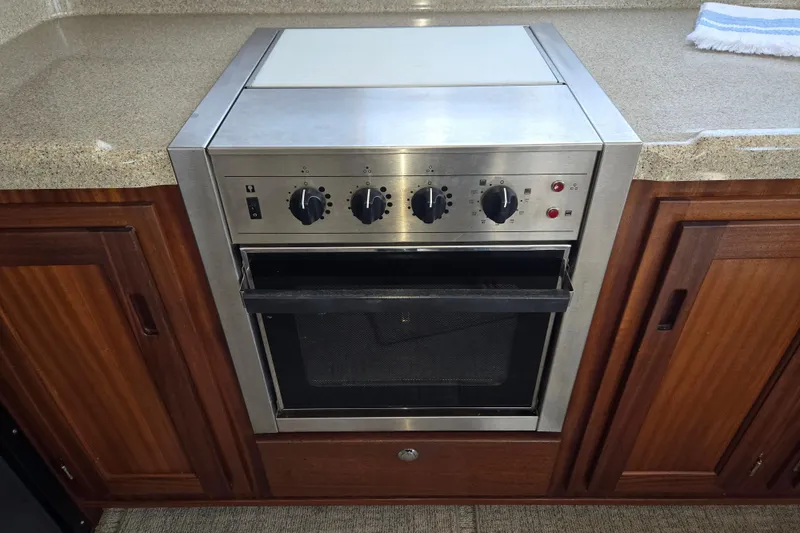 Slide: The Image of Stainless steel oven in 2012 American Tug 365 Flybridge galley kitchen. - 21