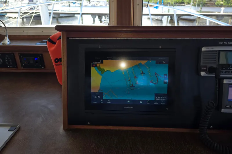 Slide: The Image of American Tug 365 Flybridge 2012 helm with Garmin navigation display. - 38