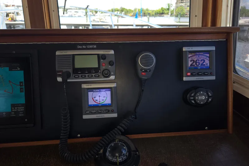 Slide: The Image of American Tug 365 Flybridge 2012 helm with Garmin navigation and communication equipment. - 39