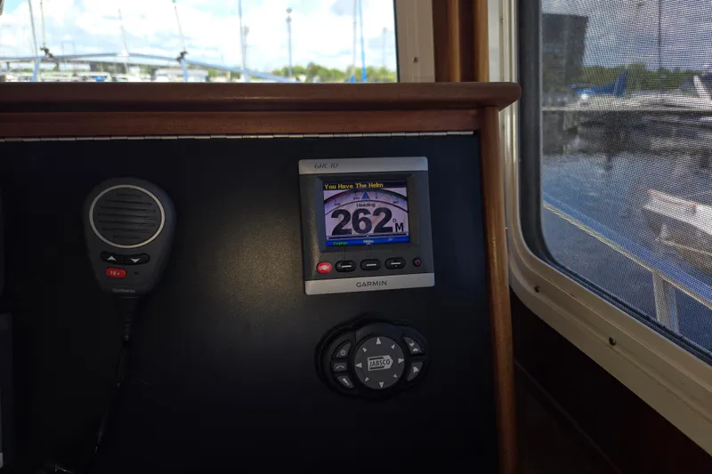 Slide: The Image of Garmin navigation display and microphone on 2012 American Tug 365 Flybridge boat. - 43