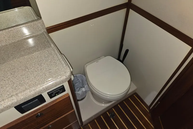Slide: The Image of Bathroom interior of 2012 American Tug 365 Flybridge with toilet and countertop. - 55