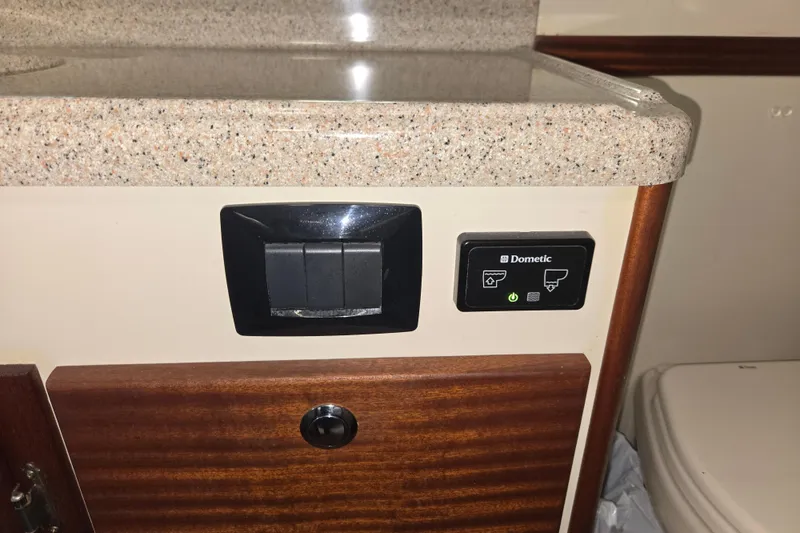 Slide: The Image of Control panel and countertop in 2012 American Tug 365 Flybridge boat interior. - 56
