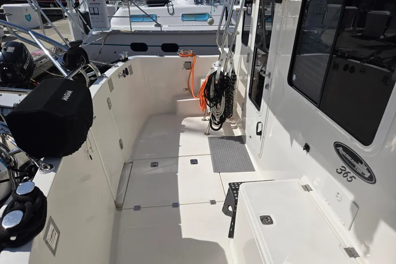 Slide: The Image of American Tug 365 Flybridge 2012 boat deck with equipment and storage compartments. - 60