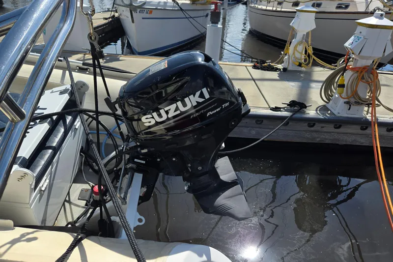 Slide: The Image of Suzuki outboard motor on 2012 American Tug 365 Flybridge at marina dock. - 65