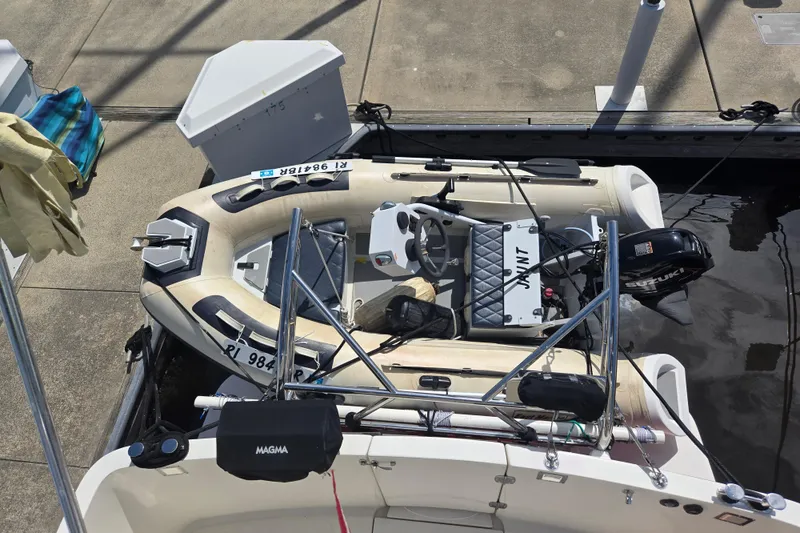 Slide: The Image of Inflatable boat docked beside a 2012 American Tug 365 Flybridge. - 66