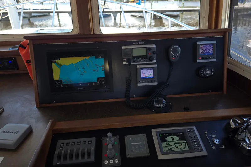 Slide: The Image of American Tug 365 Flybridge 2012 helm with navigation and communication equipment. - 7