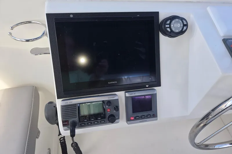 Slide: The Image of Control panel of 2012 American Tug 365 Flybridge with Garmin navigation equipment. - 75