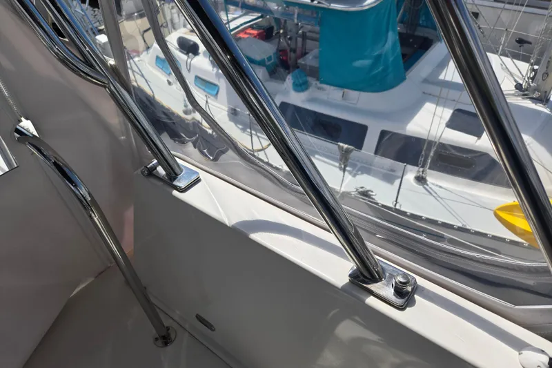 Slide: The Image of American Tug 365 Flybridge 2012, chrome railings, marina view in background. - 78